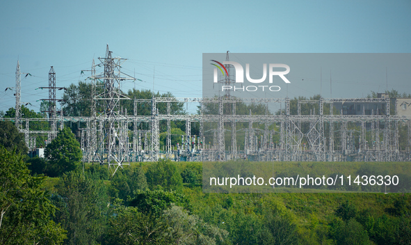 A transformer station with power lines is seen in Ivangorod, Russia accross the Narva River in Narva, Estonia on 24 July, 2024. Estonian aut...