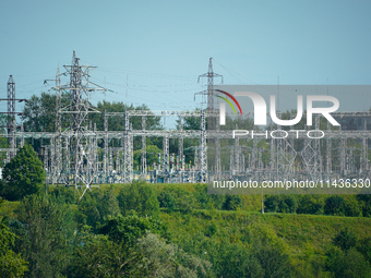 A transformer station with power lines is seen in Ivangorod, Russia accross the Narva River in Narva, Estonia on 24 July, 2024. Estonian aut...