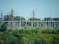 A transformer station with power lines is seen in Ivangorod, Russia accross the Narva River in Narva, Estonia on 24 July, 2024. Estonian aut...