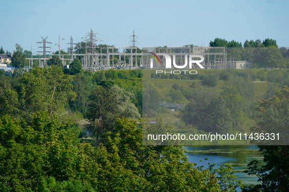 A transformer station with power lines is seen in Ivangorod, Russia accross the Narva River in Narva, Estonia on 24 July, 2024. Estonian aut...