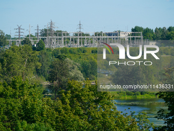 A transformer station with power lines is seen in Ivangorod, Russia accross the Narva River in Narva, Estonia on 24 July, 2024. Estonian aut...