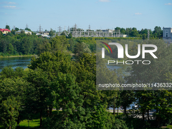 A transformer station with power lines is seen in Ivangorod, Russia accross the Narva River in Narva, Estonia on 24 July, 2024. Estonian aut...