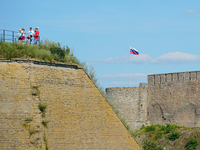 A Russian flag flies on the Ivangorod Frotress as seen from the Narva Castle in Narva, Estonia on 24 July, 2024. Estonian authorities have c...