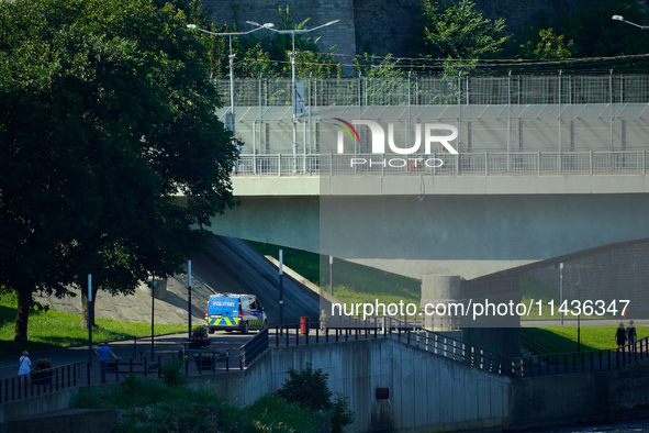 An Estonian police vehicle is seen near the bridge over the Narva River in Narva, Estonia on 24 July, 2024. Estonian authorities have closed...