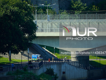 An Estonian police vehicle is seen near the bridge over the Narva River in Narva, Estonia on 24 July, 2024. Estonian authorities have closed...