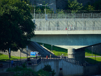 An Estonian police vehicle is seen near the bridge over the Narva River in Narva, Estonia on 24 July, 2024. Estonian authorities have closed...