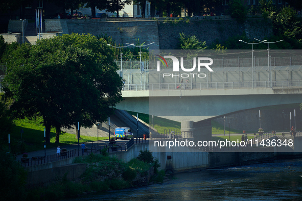 An Estonian police vehicle is seen near the bridge over the Narva River in Narva, Estonia on 24 July, 2024. Estonian authorities have closed...