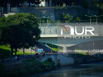 An Estonian police vehicle is seen near the bridge over the Narva River in Narva, Estonia on 24 July, 2024. Estonian authorities have closed...