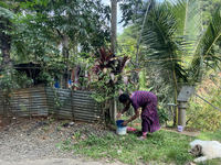 A woman is filling a bucket with drinking water in Pathanamthitta, Kerala, India, on April 05, 2024. (