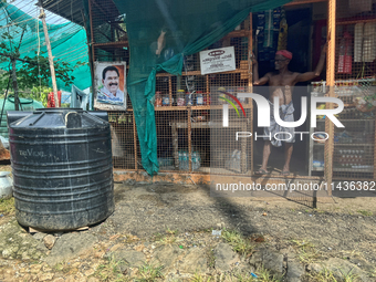 The shopkeeper is waiting for customers at his small roadside shop in Pathanamthitta, Kerala, India, on April 05, 2024. (