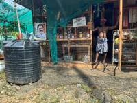 The shopkeeper is waiting for customers at his small roadside shop in Pathanamthitta, Kerala, India, on April 05, 2024. (