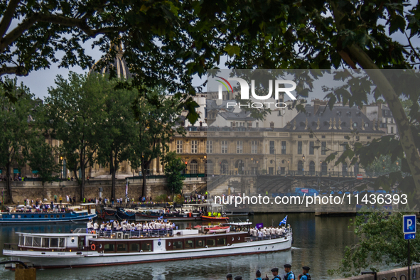 The Olympic Games of Paris 2024 are realizing the historical opening in Paris, France, on July 26, 2024. Boats with all 205 countries repres...