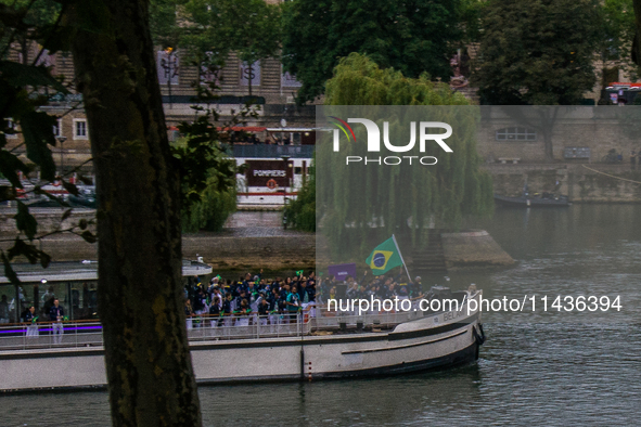 The Olympic Games of Paris 2024 are realizing the historical opening in Paris, France, on July 26, 2024. Boats with all 205 countries repres...