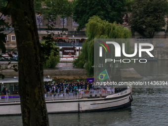 The Olympic Games of Paris 2024 are realizing the historical opening in Paris, France, on July 26, 2024. Boats with all 205 countries repres...