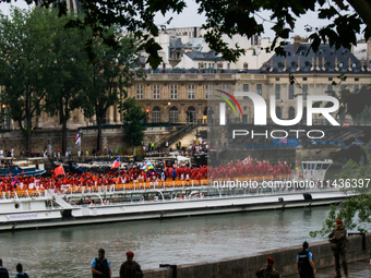 The Olympic Games of Paris 2024 are realizing the historical opening in Paris, France, on July 26, 2024. Boats with all 205 countries repres...