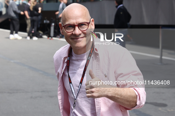 Jacques Villeneuve poses for a photo before first practice ahead of the Formula 1 Belgian Grand Prix at Spa-Francorchamps in Spa, Belgium on...