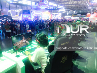 Visitors are participating in an e-sports competition at ChinaJoy 2024 in Shanghai, China, on July 26, 2024. (