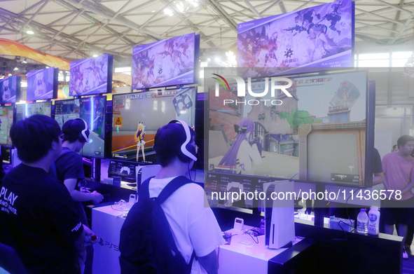 Players are playing a new PS5 game at the SONY exhibition area at ChinaJoy 2024 in Shanghai, China, on July 26, 2024. 