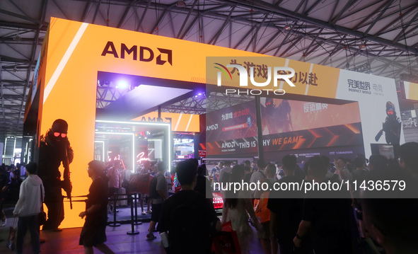 Players are experiencing the latest AI esports hardware devices at the AMD exhibition area at ChinaJoy 2024 in Shanghai, China, on July 26,...