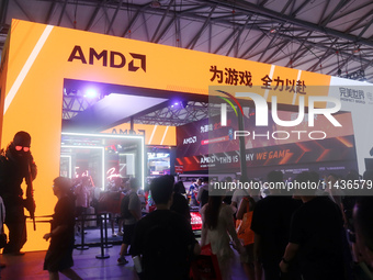 Players are experiencing the latest AI esports hardware devices at the AMD exhibition area at ChinaJoy 2024 in Shanghai, China, on July 26,...