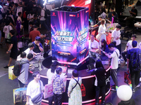 Players are experiencing the latest AI e-sports hardware devices at the Lenovo exhibition area at ChinaJoy 2024 in Shanghai, China, on July...