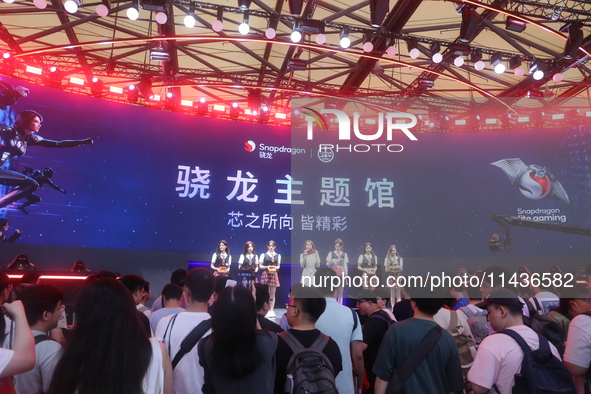 Players are experiencing the latest AI esports hardware devices at the Qualcomm Snapdragon theme Hall at ChinaJoy 2024 in Shanghai, China, o...