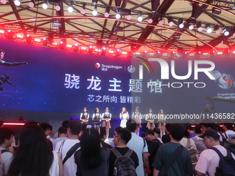 Players are experiencing the latest AI esports hardware devices at the Qualcomm Snapdragon theme Hall at ChinaJoy 2024 in Shanghai, China, o...