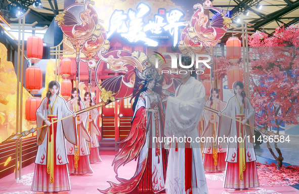 Traditional Chinese costume cosplay and virtual character interaction are happening at the Perfect World exhibition area in Shanghai, China,...