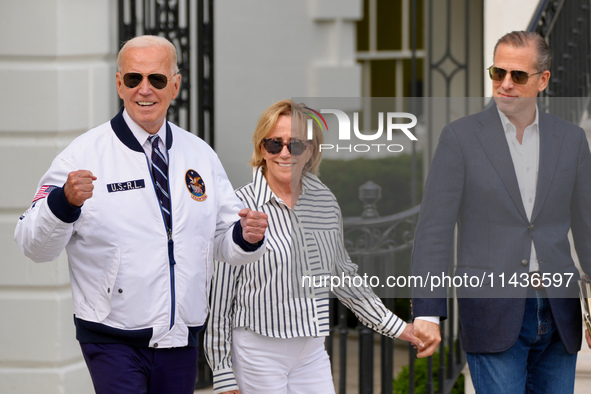 President Biden Wears US Olympic Team Attire As He Boards Marine One With His Sister Valerie Biden Owen's And Son Hunter Biden, in Washingto...