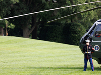 U.S. Marines wait for President Joe Biden to depart the White House to board Marine One en route to Camp David on July 26, 2024. (