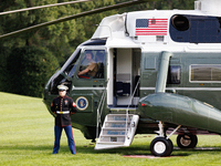 U.S. Marines wait for President Joe Biden to depart the White House to board Marine One en route to Camp David on July 26, 2024. (