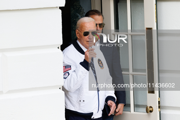 U.S. President Joe Biden, wearing a Team USA 2024 Olympics jacket, departs the White House to board Marine One en route to Camp David on Jul...