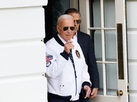 U.S. President Joe Biden, wearing a Team USA 2024 Olympics jacket, departs the White House to board Marine One en route to Camp David on Jul...