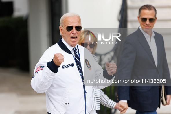 U.S. President Joe Biden, wearing a Team USA 2024 Olympics jacket, departs the White House, accompanied by his sister Valerie Biden Owens an...