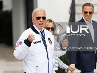 U.S. President Joe Biden, wearing a Team USA 2024 Olympics jacket, departs the White House, accompanied by his sister Valerie Biden Owens an...