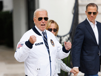 U.S. President Joe Biden, wearing a Team USA 2024 Olympics jacket, departs the White House, accompanied by his sister Valerie Biden Owens an...