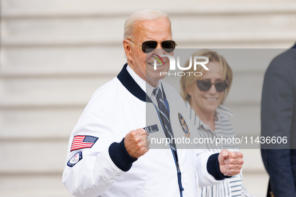 U.S. President Joe Biden, wearing a Team USA 2024 Olympics jacket, departs the White House, accompanied by his sister Valerie Biden Owens an...