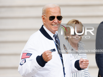 U.S. President Joe Biden, wearing a Team USA 2024 Olympics jacket, departs the White House, accompanied by his sister Valerie Biden Owens an...