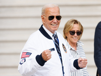 U.S. President Joe Biden, wearing a Team USA 2024 Olympics jacket, departs the White House, accompanied by his sister Valerie Biden Owens an...