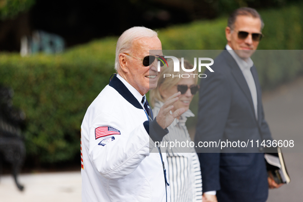 U.S. President Joe Biden, wearing a Team USA 2024 Olympics jacket, departs the White House, accompanied by his sister Valerie Biden Owens an...