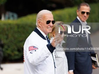 U.S. President Joe Biden, wearing a Team USA 2024 Olympics jacket, departs the White House, accompanied by his sister Valerie Biden Owens an...