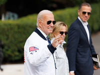 U.S. President Joe Biden, wearing a Team USA 2024 Olympics jacket, departs the White House, accompanied by his sister Valerie Biden Owens an...