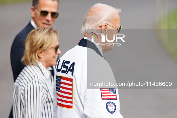 U.S. President Joe Biden, wearing a Team USA 2024 Olympics jacket, departs the White House, accompanied by his sister Valerie Biden Owens an...