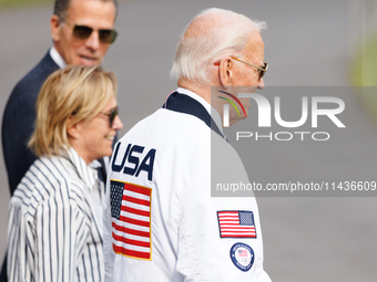 U.S. President Joe Biden, wearing a Team USA 2024 Olympics jacket, departs the White House, accompanied by his sister Valerie Biden Owens an...