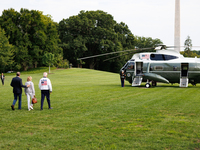 U.S. President Joe Biden, wearing a Team USA 2024 Olympics jacket, departs the White House, accompanied by his sister Valerie Biden Owens an...