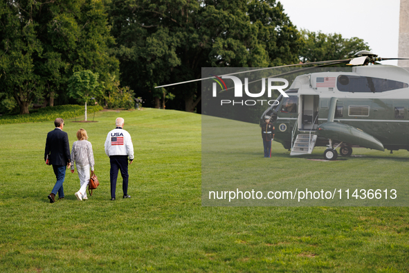 U.S. President Joe Biden, wearing a Team USA 2024 Olympics jacket, departs the White House, accompanied by his sister Valerie Biden Owens an...