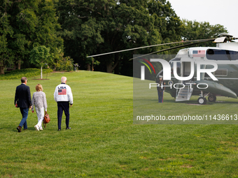 U.S. President Joe Biden, wearing a Team USA 2024 Olympics jacket, departs the White House, accompanied by his sister Valerie Biden Owens an...