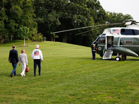 U.S. President Joe Biden, wearing a Team USA 2024 Olympics jacket, departs the White House, accompanied by his sister Valerie Biden Owens an...