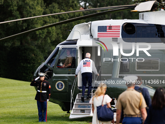 U.S. President Joe Biden, wearing a Team USA 2024 Olympics jacket, boards Marine One en route to Camp David on the South Lawn of the White H...