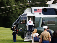 U.S. President Joe Biden, wearing a Team USA 2024 Olympics jacket, boards Marine One en route to Camp David on the South Lawn of the White H...